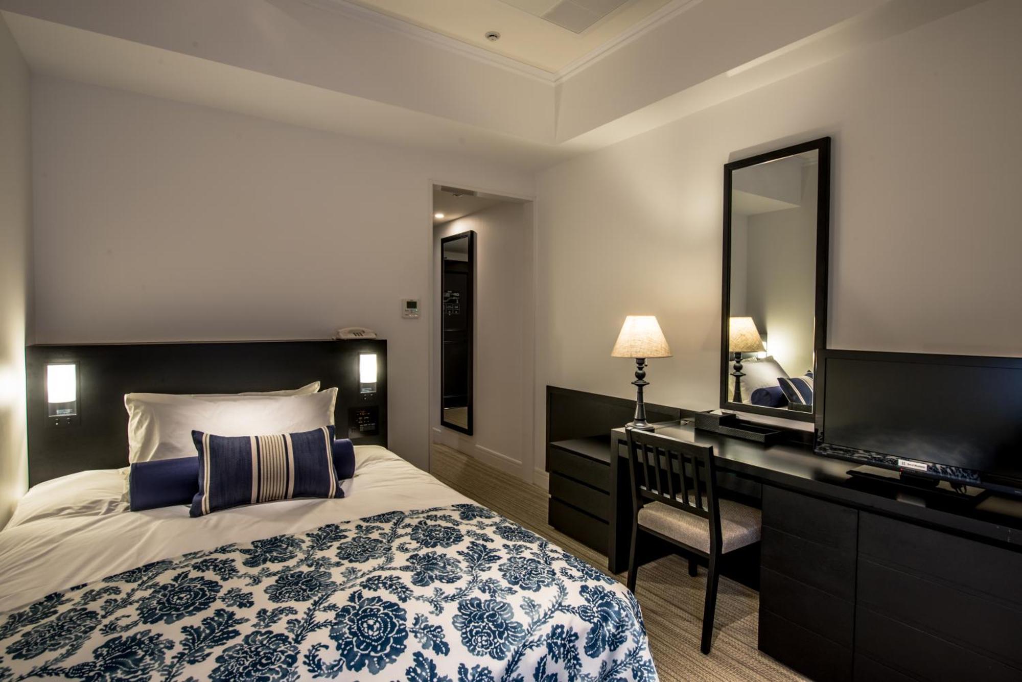 منتجع وسبا فندق مونتيري أوكيناوا أونا المظهر الخارجي الصورة A bedroom at the hotel